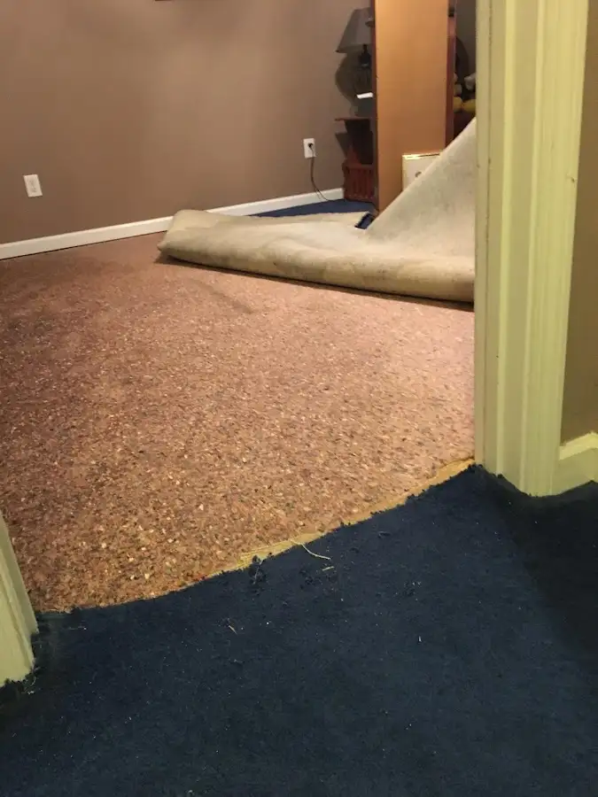 Carpet pad removal revealing water damage during Drying & Dehumidification in Cottonwood